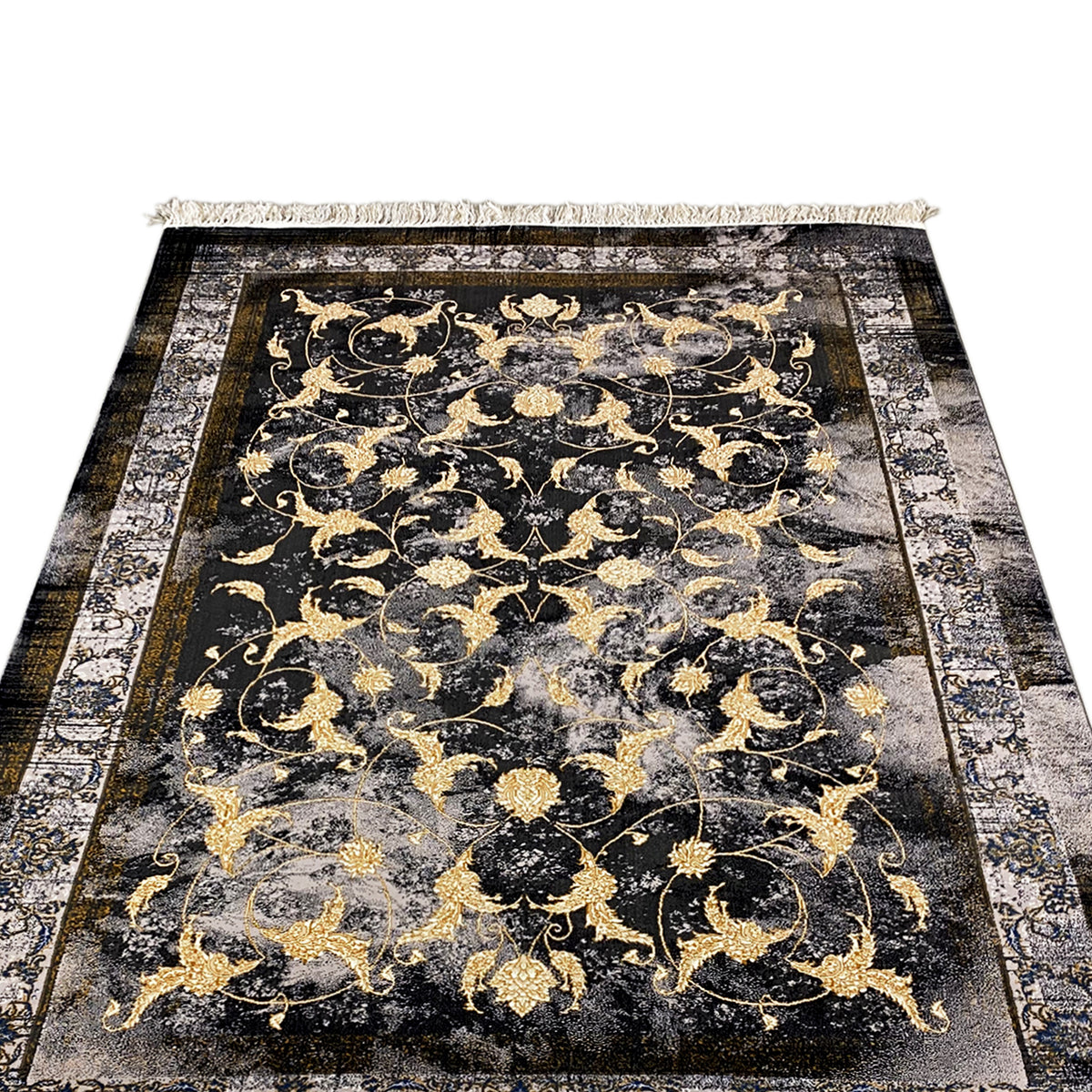 Kenza-tapijt 160x230 cm: close-up van het florale gouden patroon op een donkere achtergrond