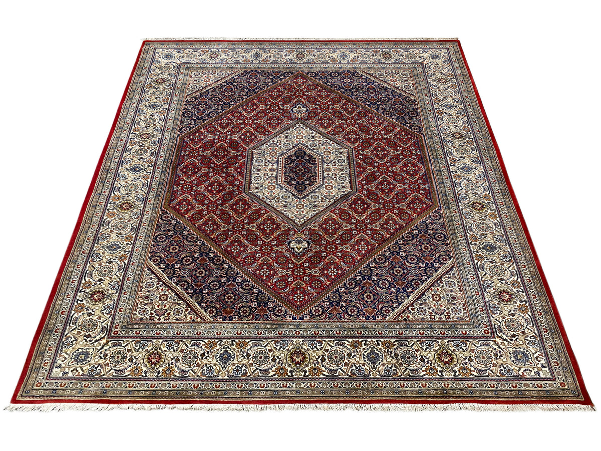 Tapijt met rood hart-/medaillonmotief en veelkleurige ornamentboorden
