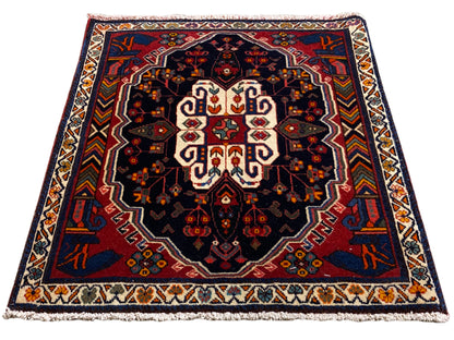 Poshti-tapijt rechthoekig met blauwe achtergrond en symmetrisch ornamentpatroon