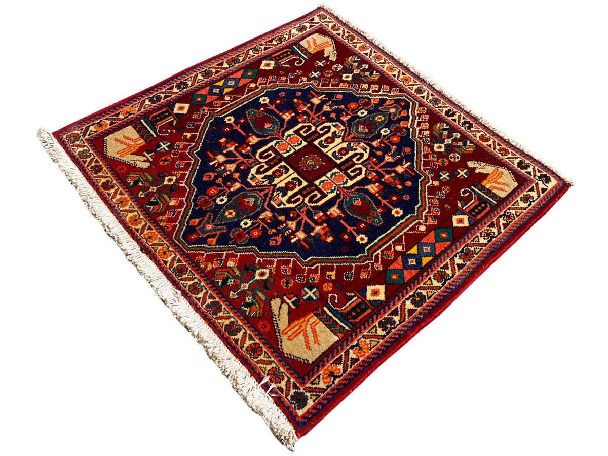 Poshti-tapijt 64x64 cm, vierkant, diagonaal, donkerblauw medaillon, kleurrijke details, franjes