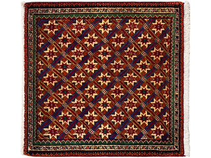 Poshti-tapijt 62x52 cm, donker gekleurd met kleurrijke sterren en franjes.