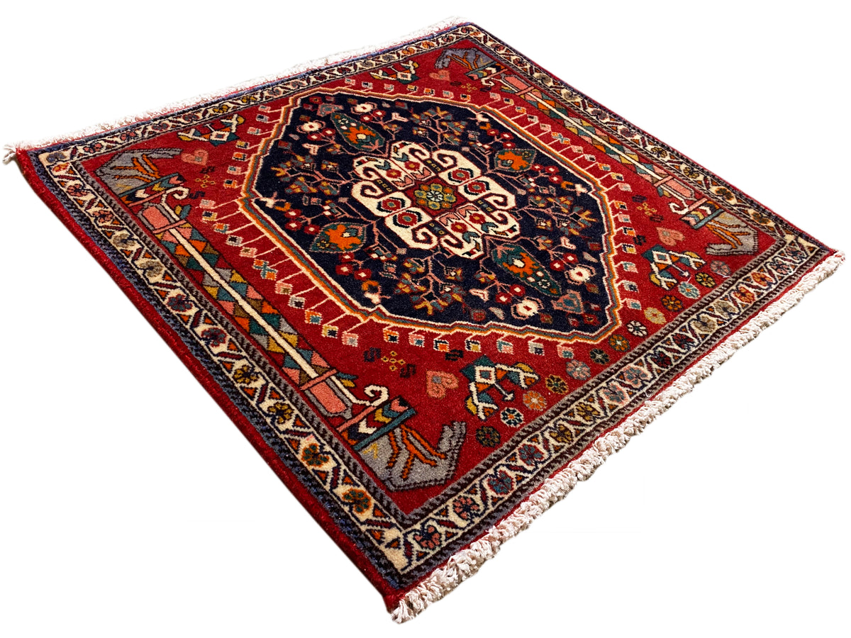 Vloerkleed met rode basis en blauw ornamentpatroon, rechthoekig, met franjes
