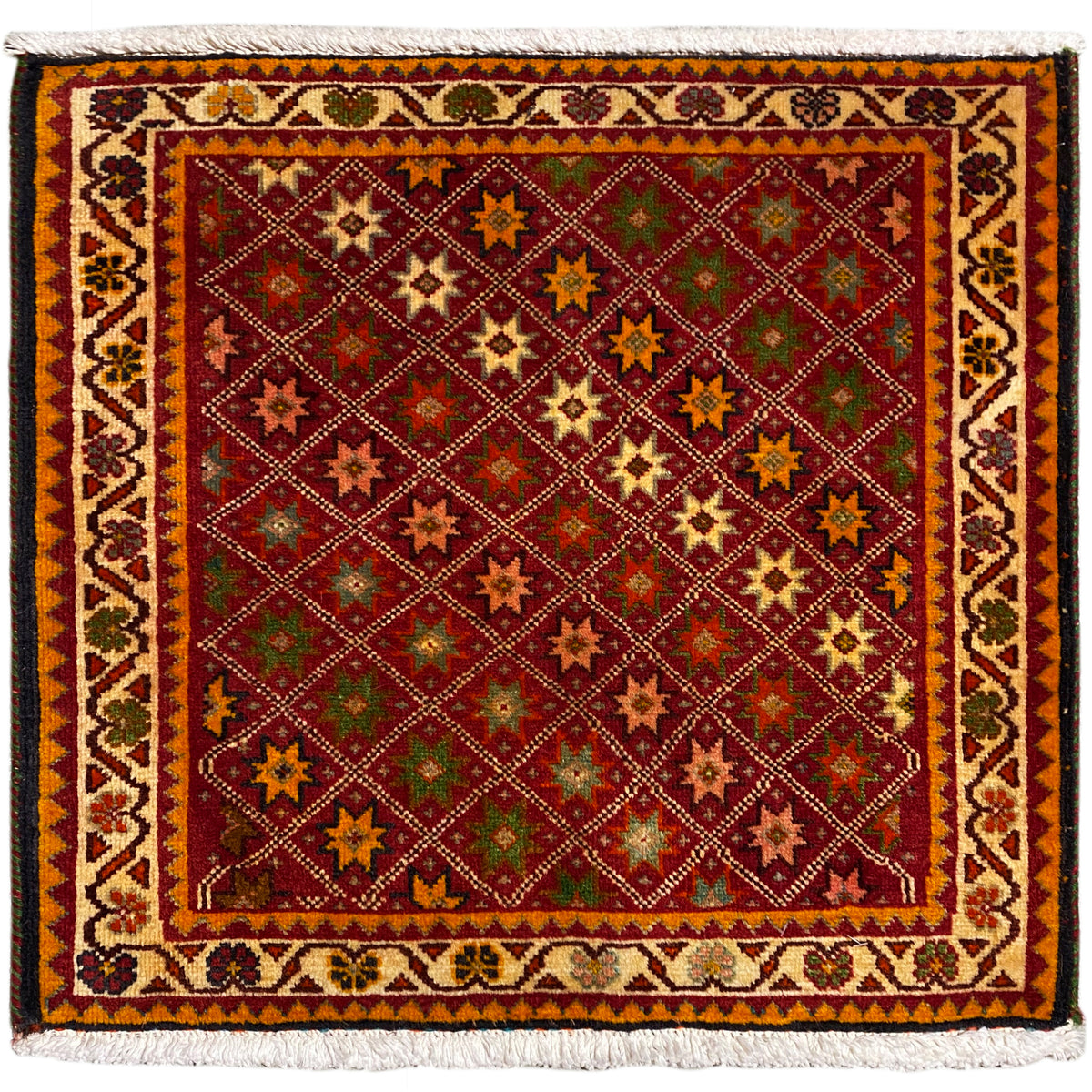 Poshti-tapijt, rechthoekig, meerkleurig met decoratieve sterpatronen en een franjerand.