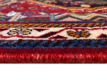 Poshti-tapijt: franjesnaad en zelfkant met kleurverloop van blauw naar rood